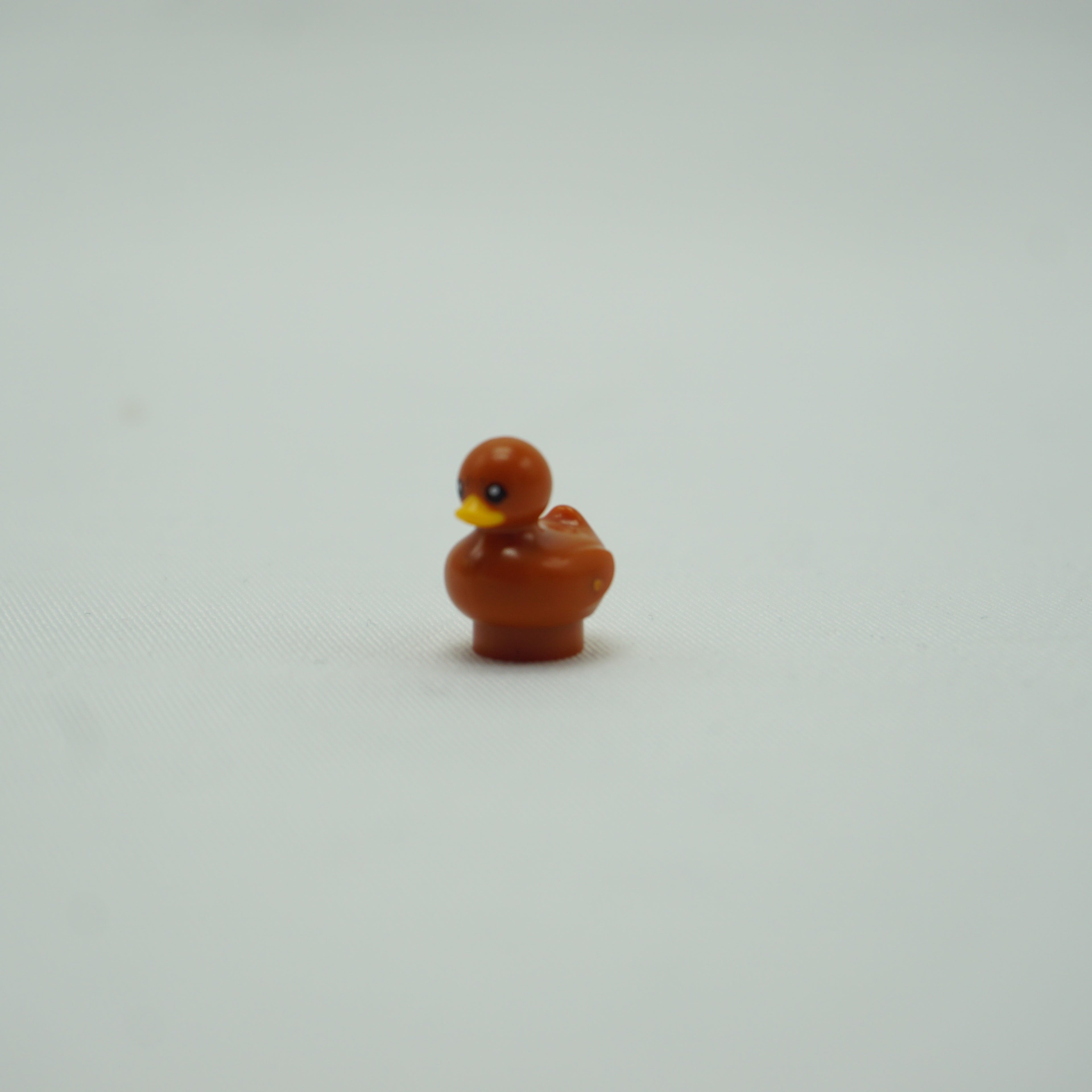 Part 49661pb03 - Duckling with Molded Bright Light Orange Beak and Printed Black Eyes and Reddish Brown Spots Pattern